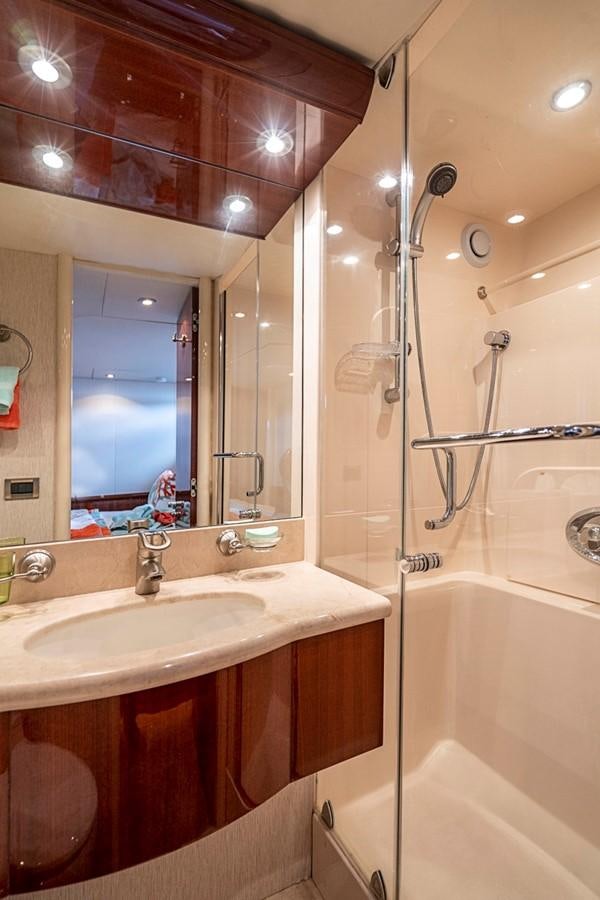a bathroom with a shower and sink aboard RENDEZVOUS Yacht for Sale
