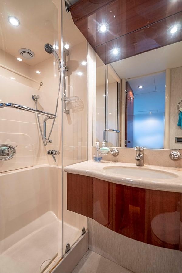 a bathroom with a bathtub sink and a shower aboard RENDEZVOUS Yacht for Sale