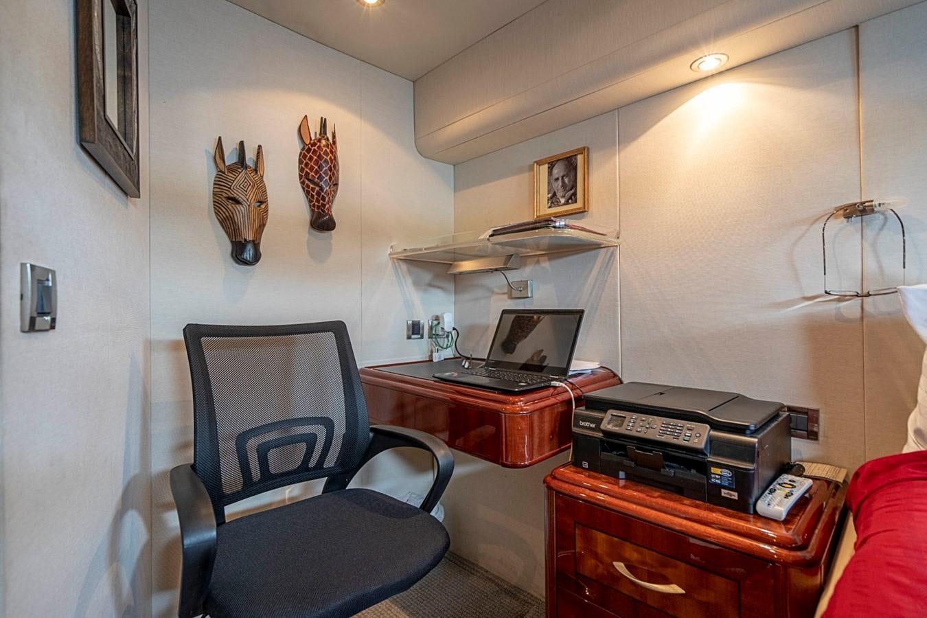 a room with a desk and a chair aboard RENDEZVOUS Yacht for Sale