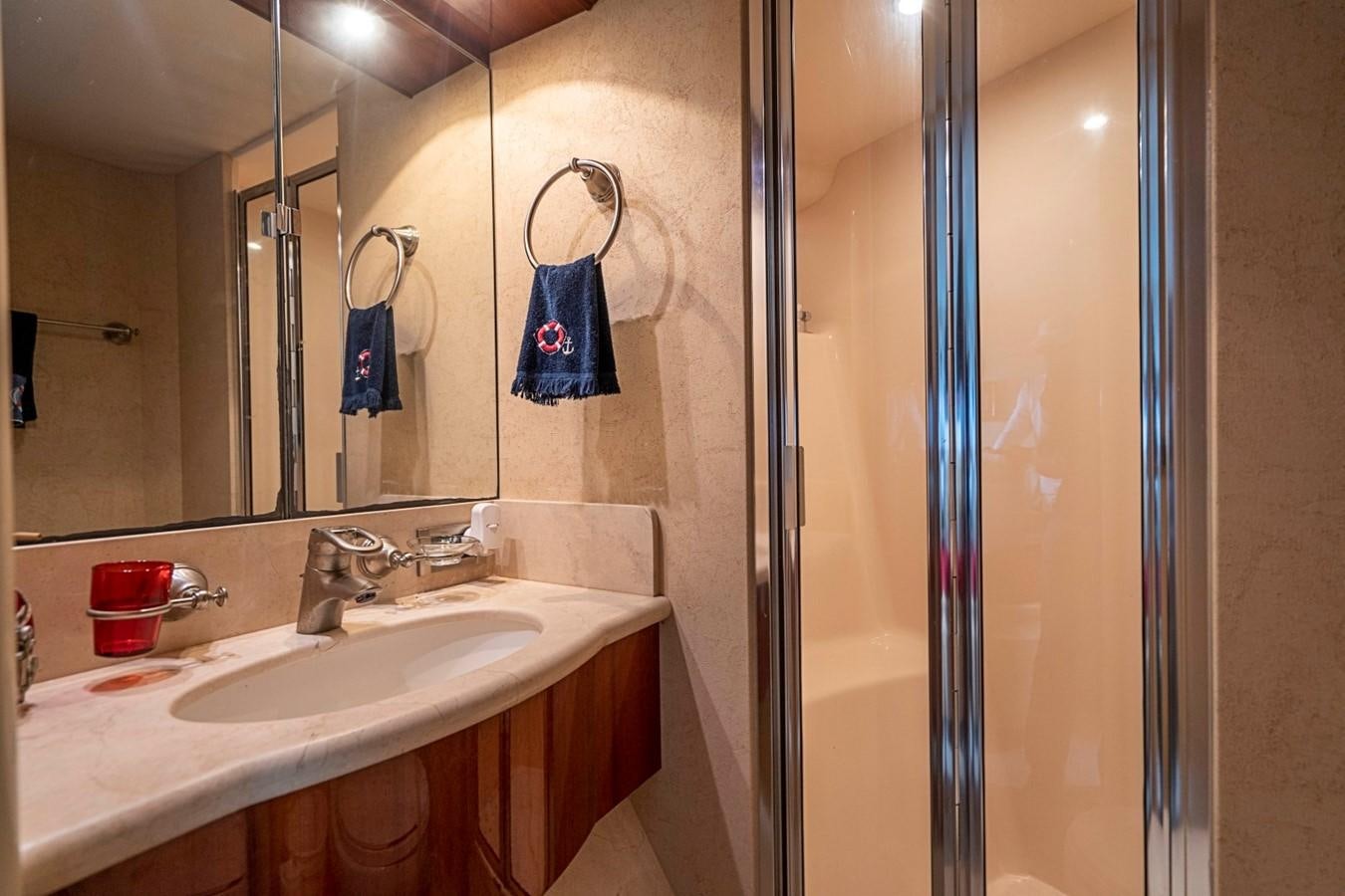 a bathroom with a sink and a shower aboard RENDEZVOUS Yacht for Sale