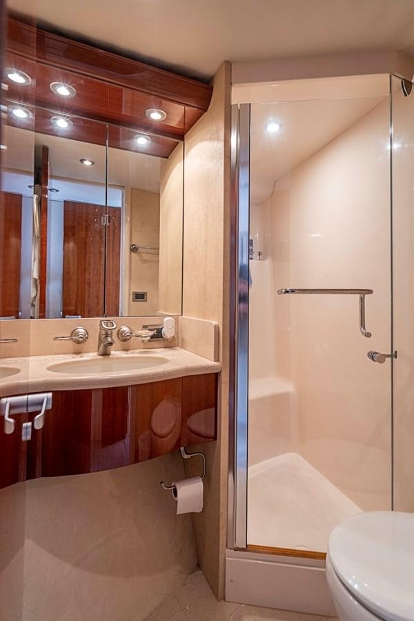 a bathroom with a glass shower aboard RENDEZVOUS Yacht for Sale