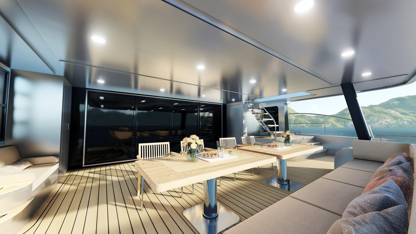 a room with a table and couch aboard HSY-80 Yacht for Sale