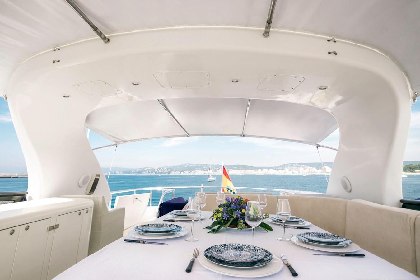 a room with a table and chairs aboard ROSIQUE Yacht for Sale