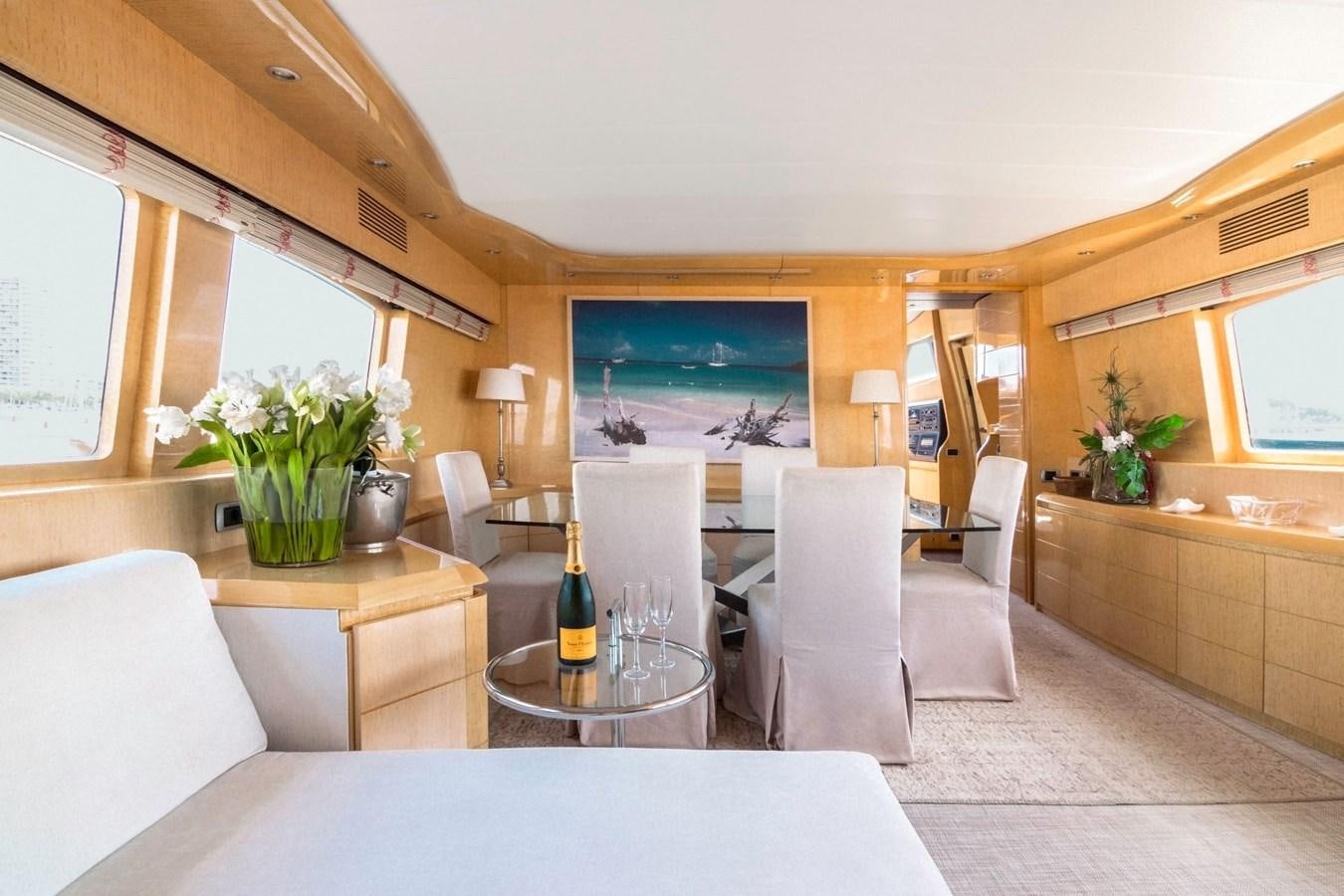a living room with a table and chairs aboard ROSIQUE Yacht for Sale