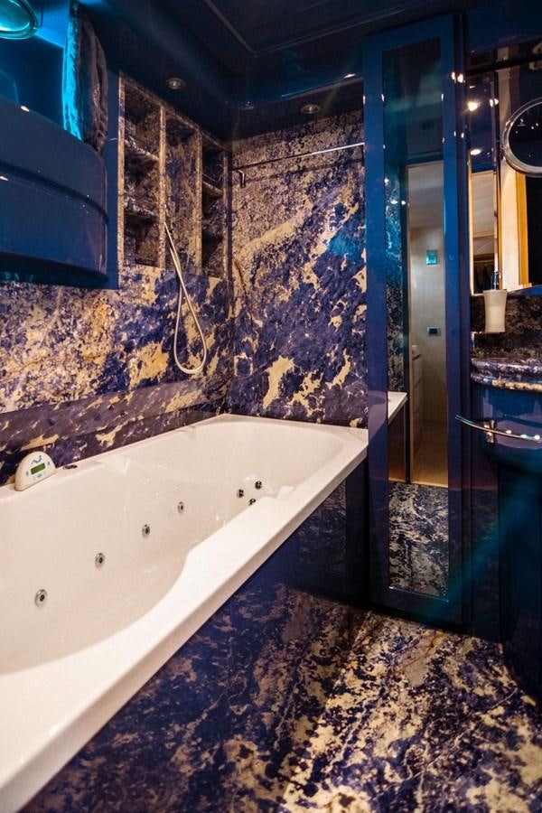 a bathroom with a large tub aboard ROSIQUE Yacht for Sale