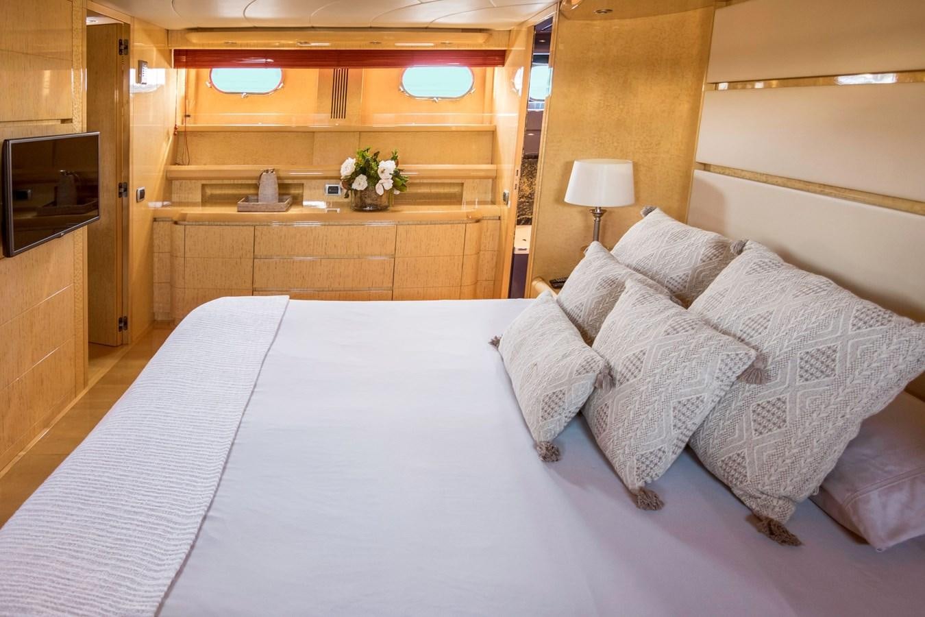 a bed with white sheets aboard ROSIQUE Yacht for Sale