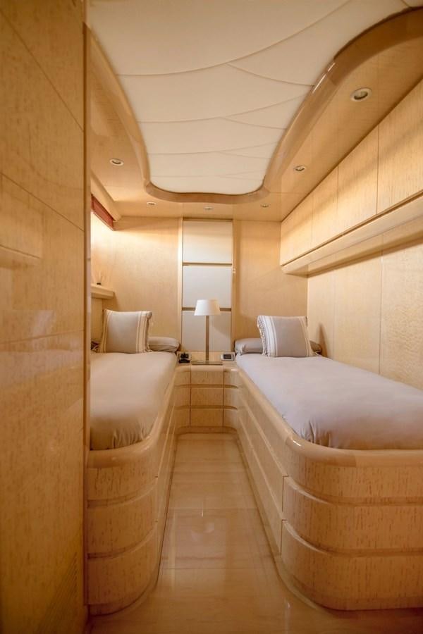 a room with a bed and a chair aboard ROSIQUE Yacht for Sale