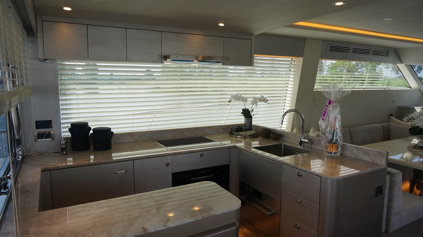 a kitchen with a large window aboard ALILEA Yacht for Sale