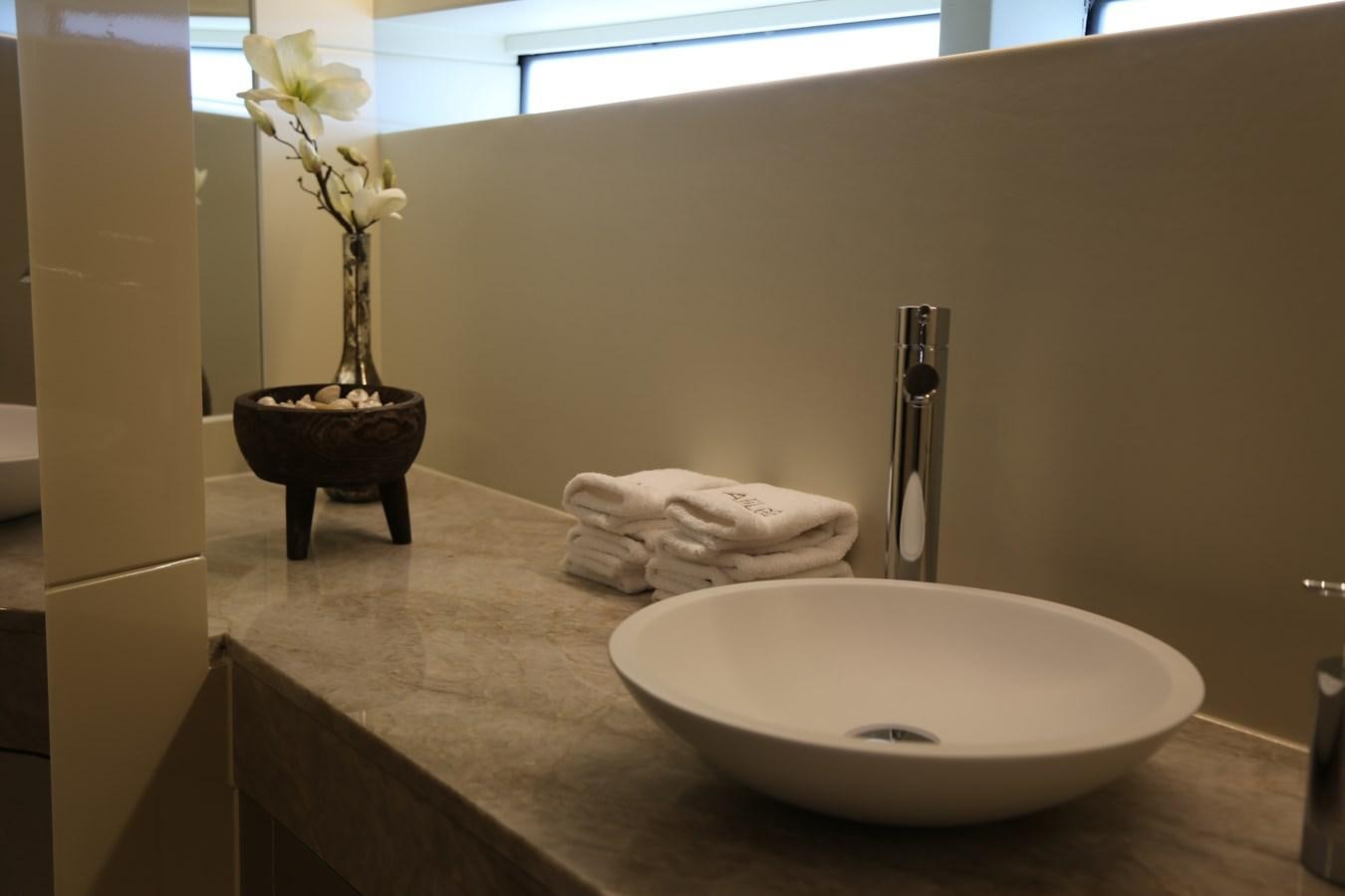 a bathroom with a sink and a mirror aboard ALILEA Yacht for Sale