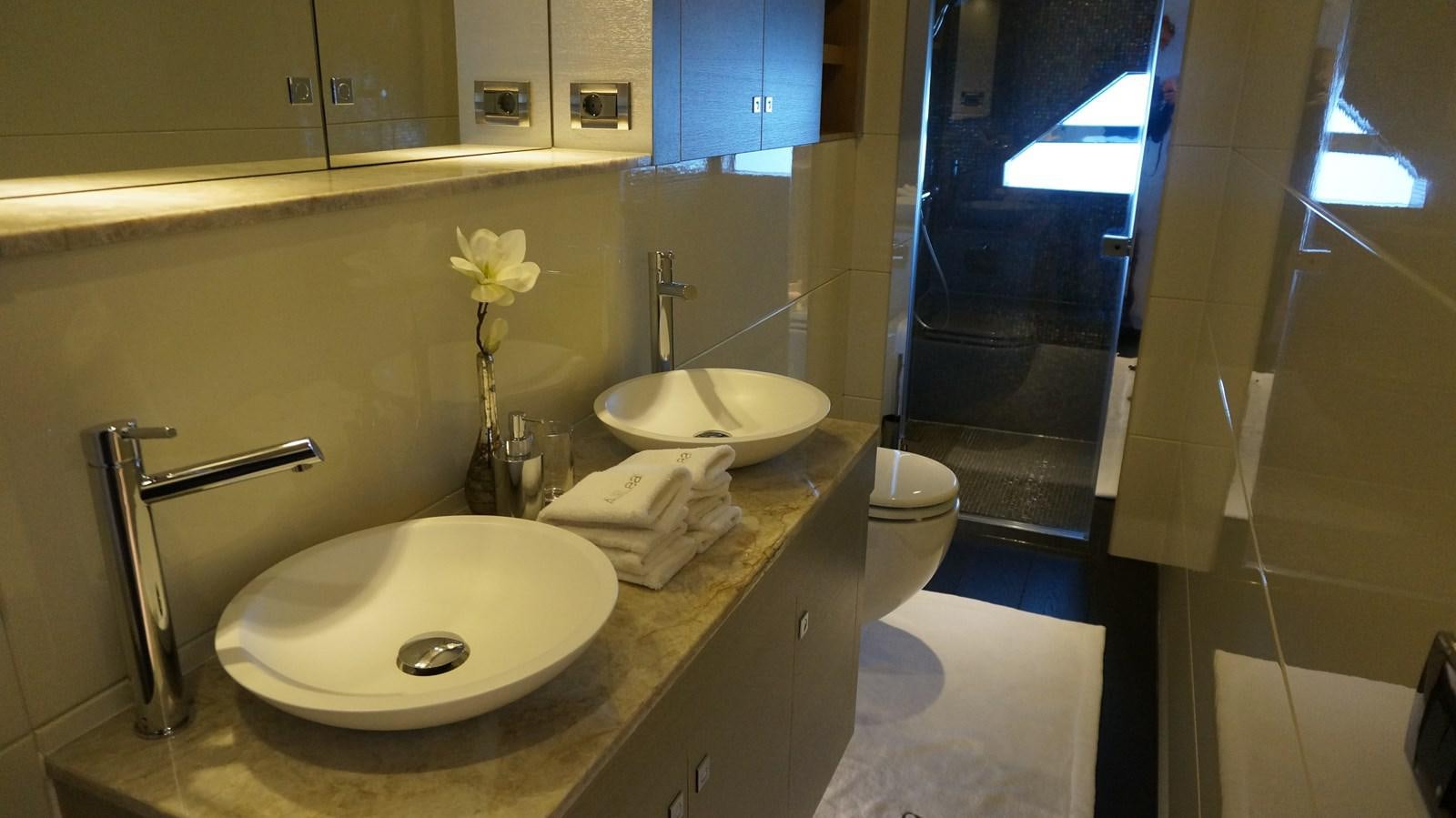 a bathroom with a sink and a toilet aboard ALILEA Yacht for Sale