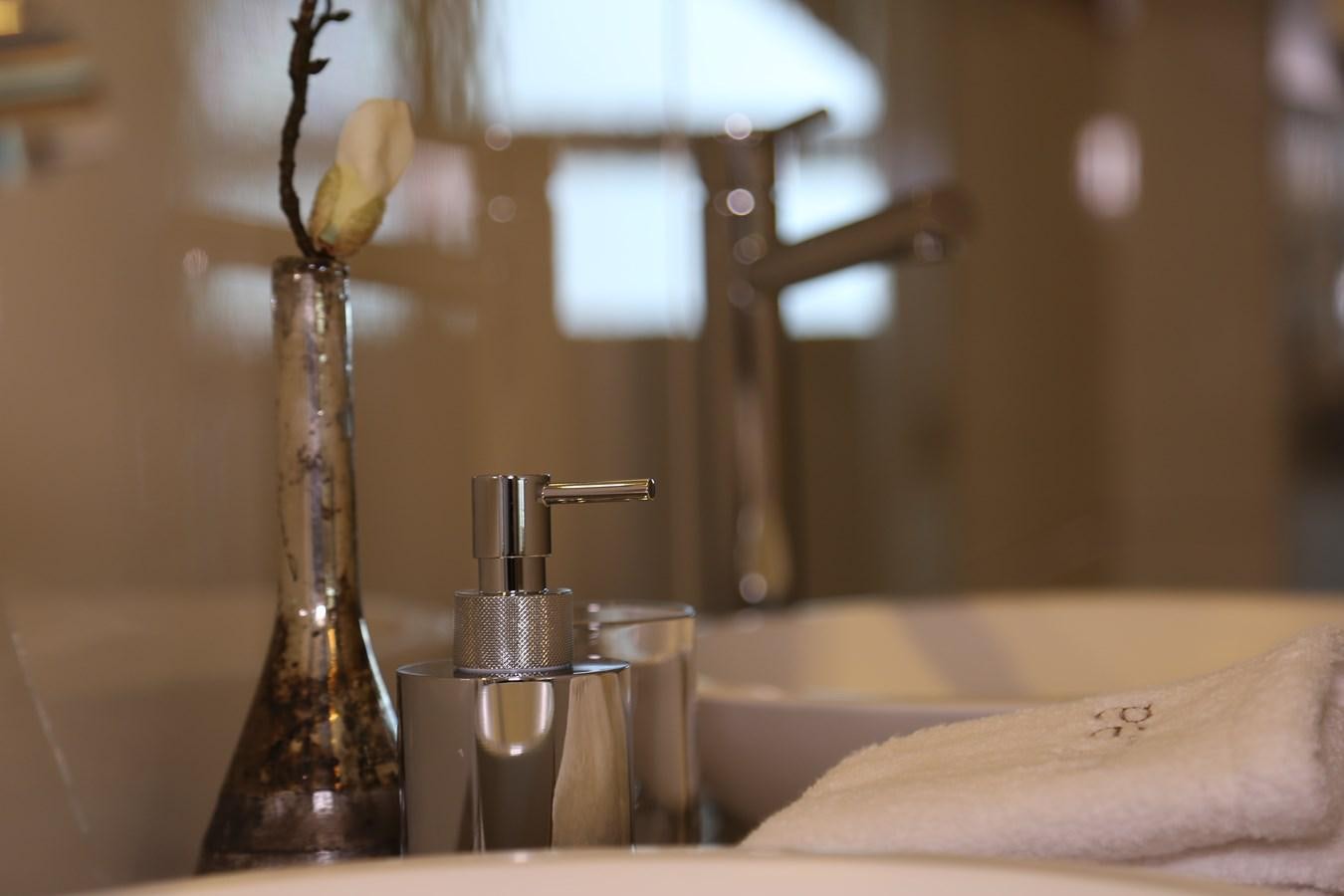 a glass vase with a flower aboard ALILEA Yacht for Sale