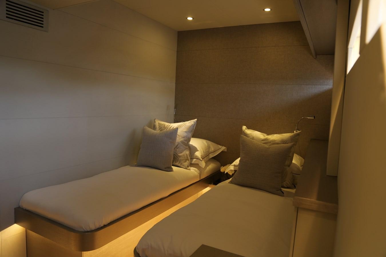 a room with two beds aboard ALILEA Yacht for Sale