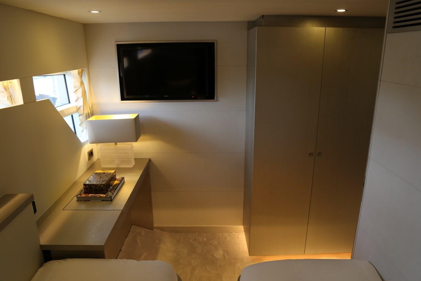 a room with a tv and a table aboard ALILEA Yacht for Sale