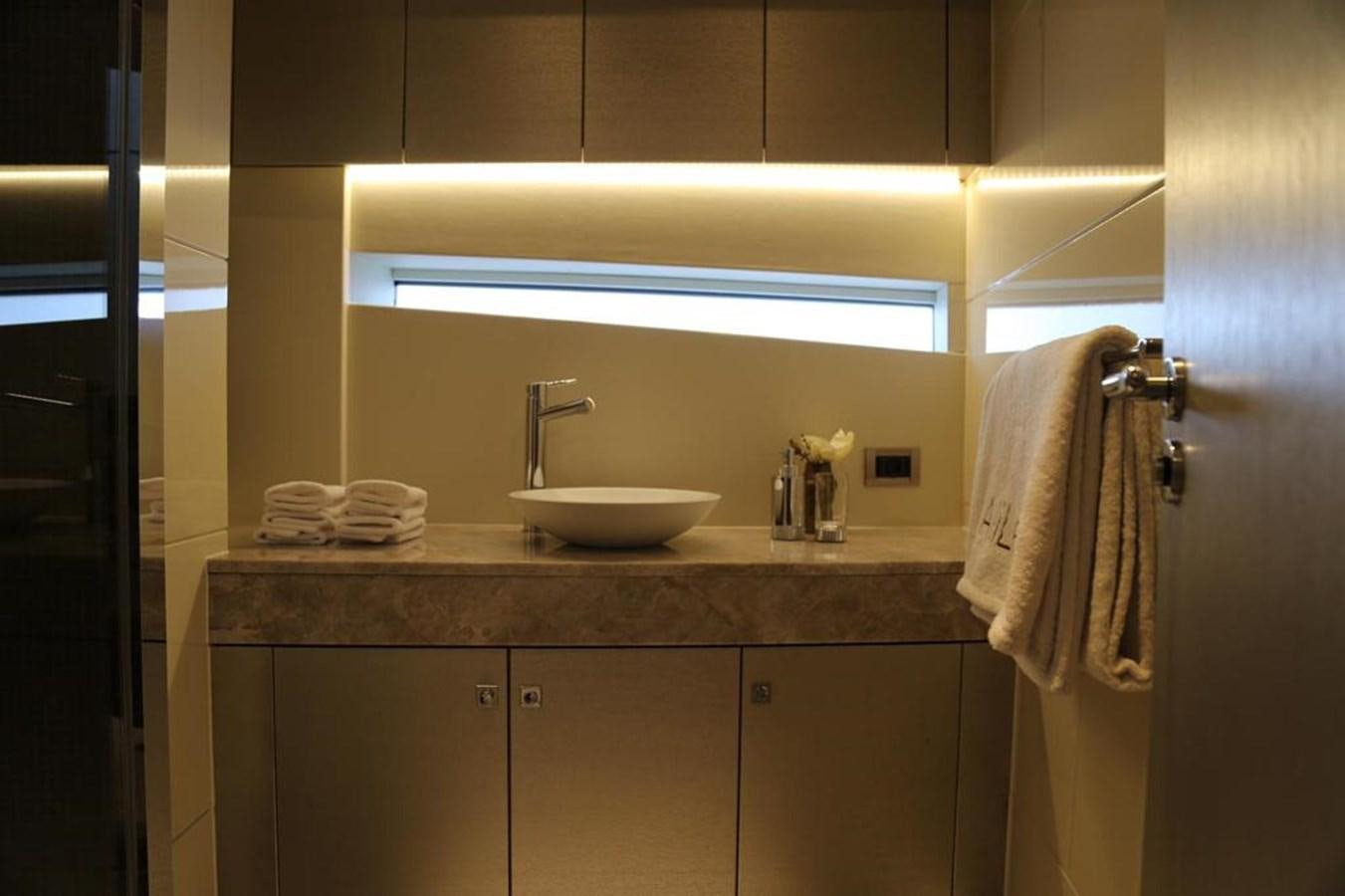 a bathroom with a sink and a mirror aboard ALILEA Yacht for Sale