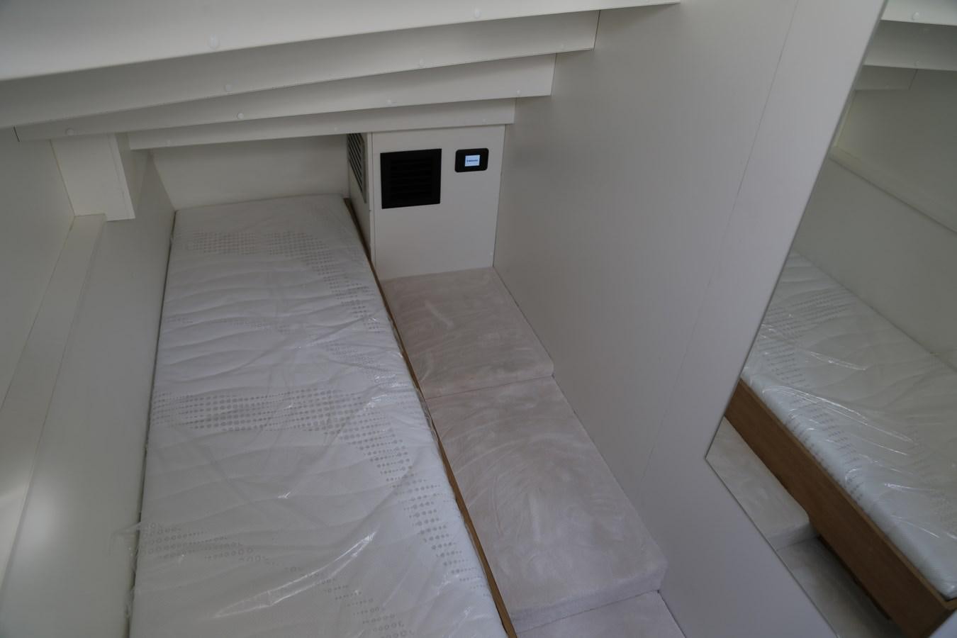 a white room with a white wall aboard ALILEA Yacht for Sale