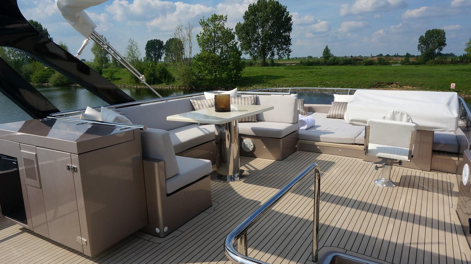 a patio with a table and chairs aboard ALILEA Yacht for Sale