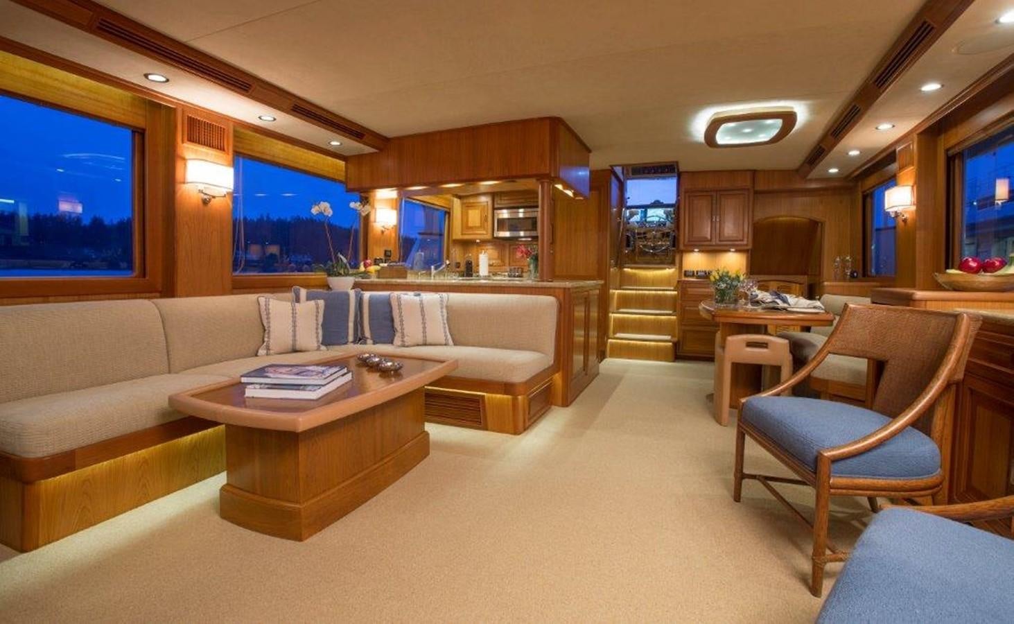 a living room with a couch and a table aboard FLEMING 78 - NEW BUILD Yacht for Sale
