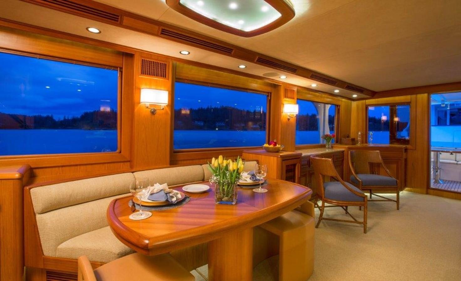 a room with a table and chairs aboard FLEMING 78 - NEW BUILD Yacht for Sale