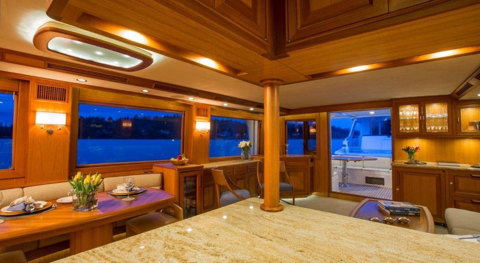 a room with a tv and a table aboard FLEMING 78 - NEW BUILD Yacht for Sale