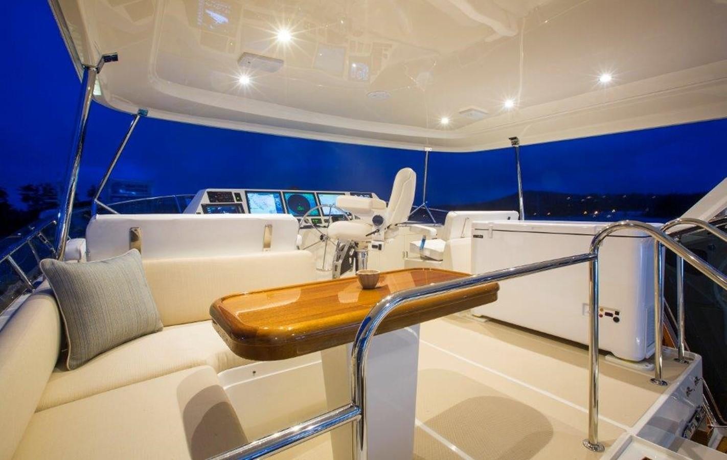 a boat with a table and chairs aboard FLEMING 78 - NEW BUILD Yacht for Sale