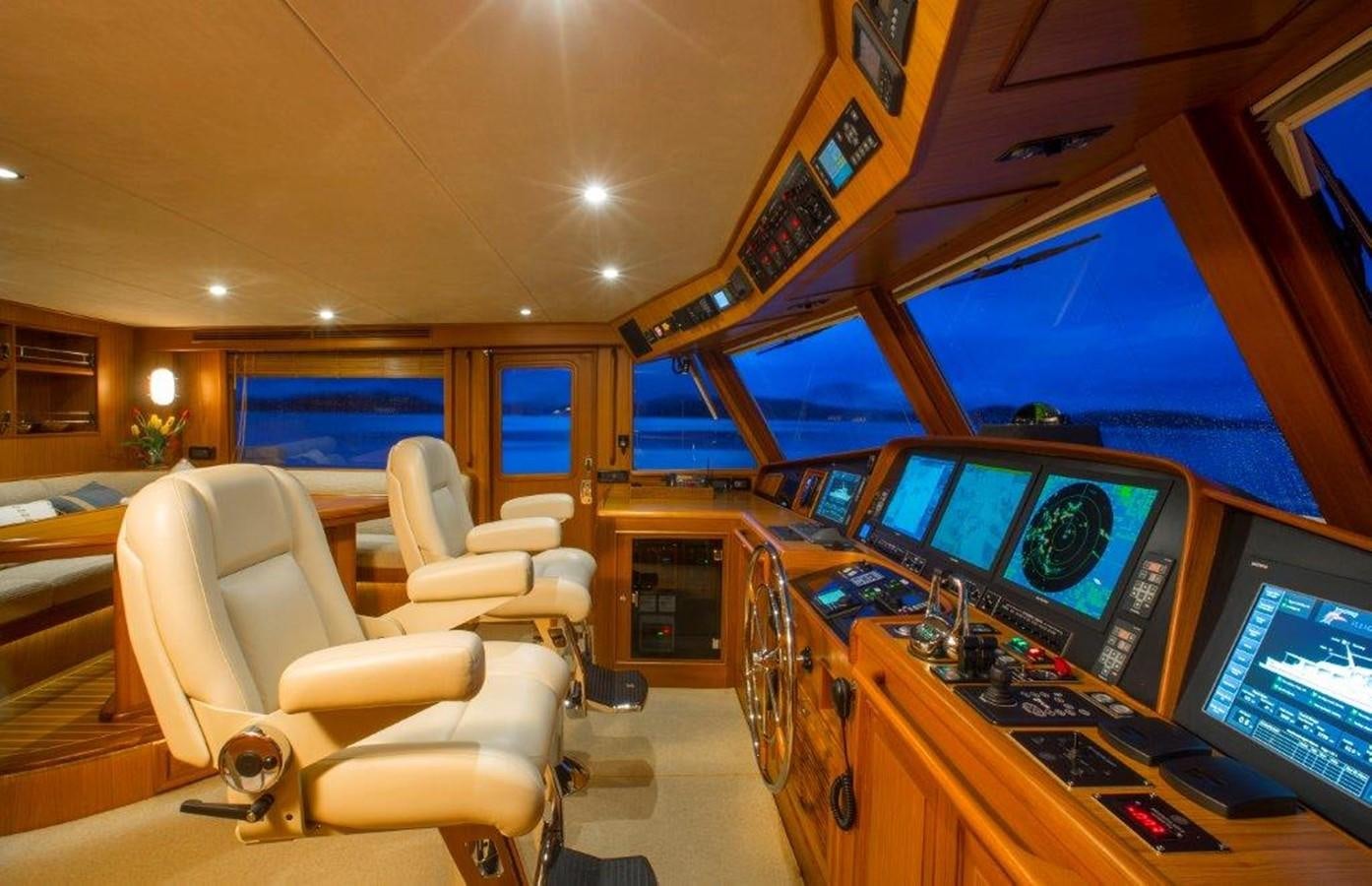 a room with many monitors and chairs aboard FLEMING 78 - NEW BUILD Yacht for Sale