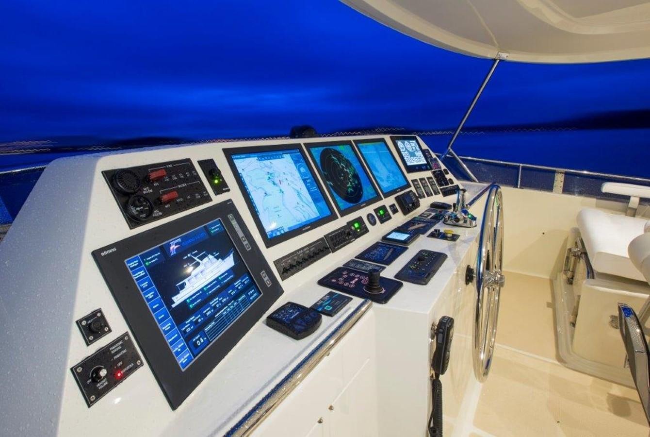 several electronic devices on a white table aboard FLEMING 78 - NEW BUILD Yacht for Sale
