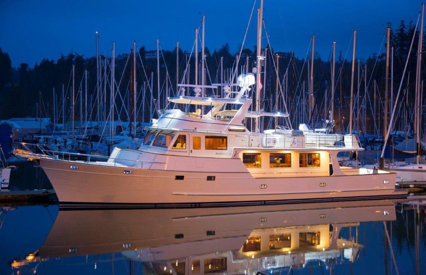 a large white boat in a harbor aboard FLEMING 78 - NEW BUILD Yacht for Sale