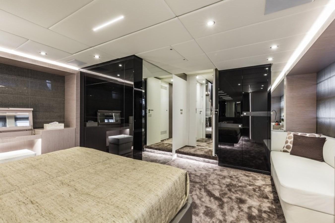 a large modern bedroom aboard BULL Yacht for Sale