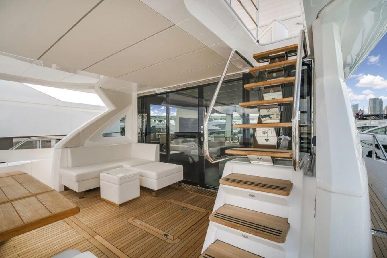 a room with a staircase and a large window aboard SOLAIRE Yacht for Sale