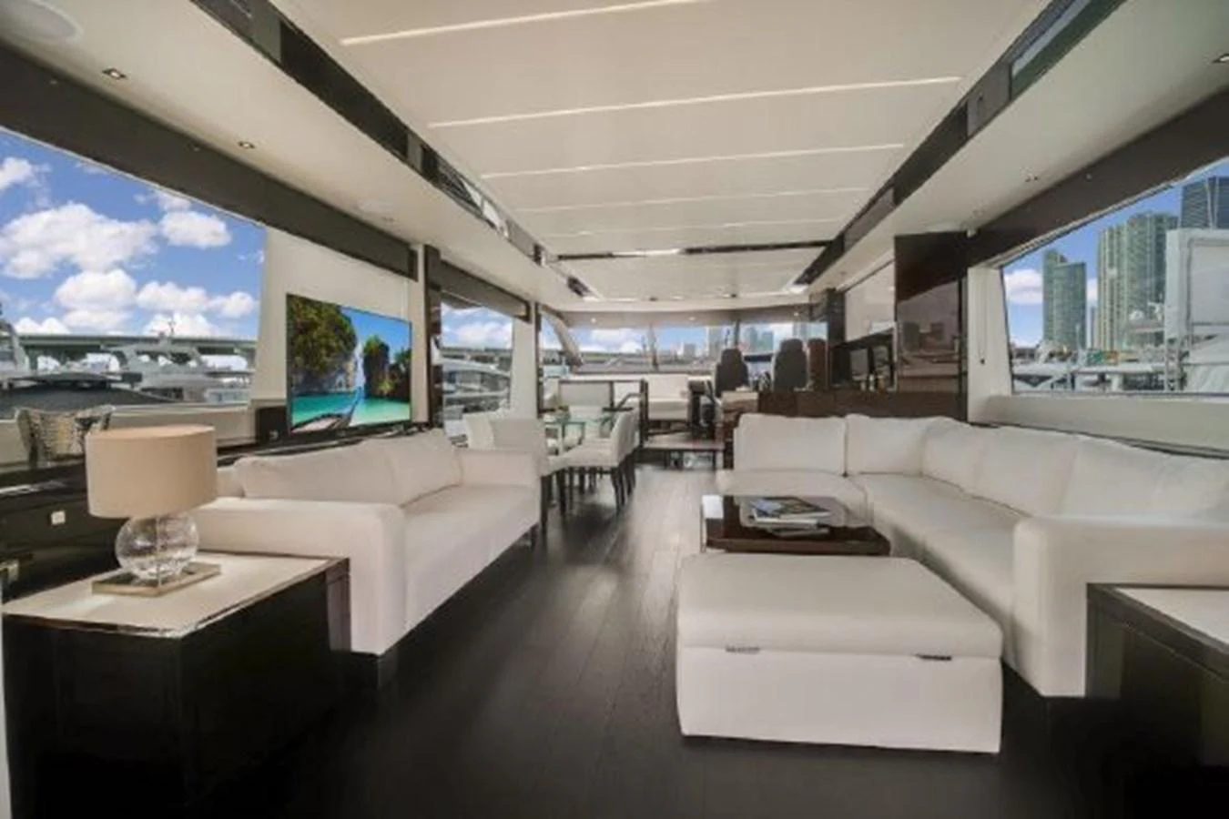a living room with a large screen aboard SOLAIRE Yacht for Sale