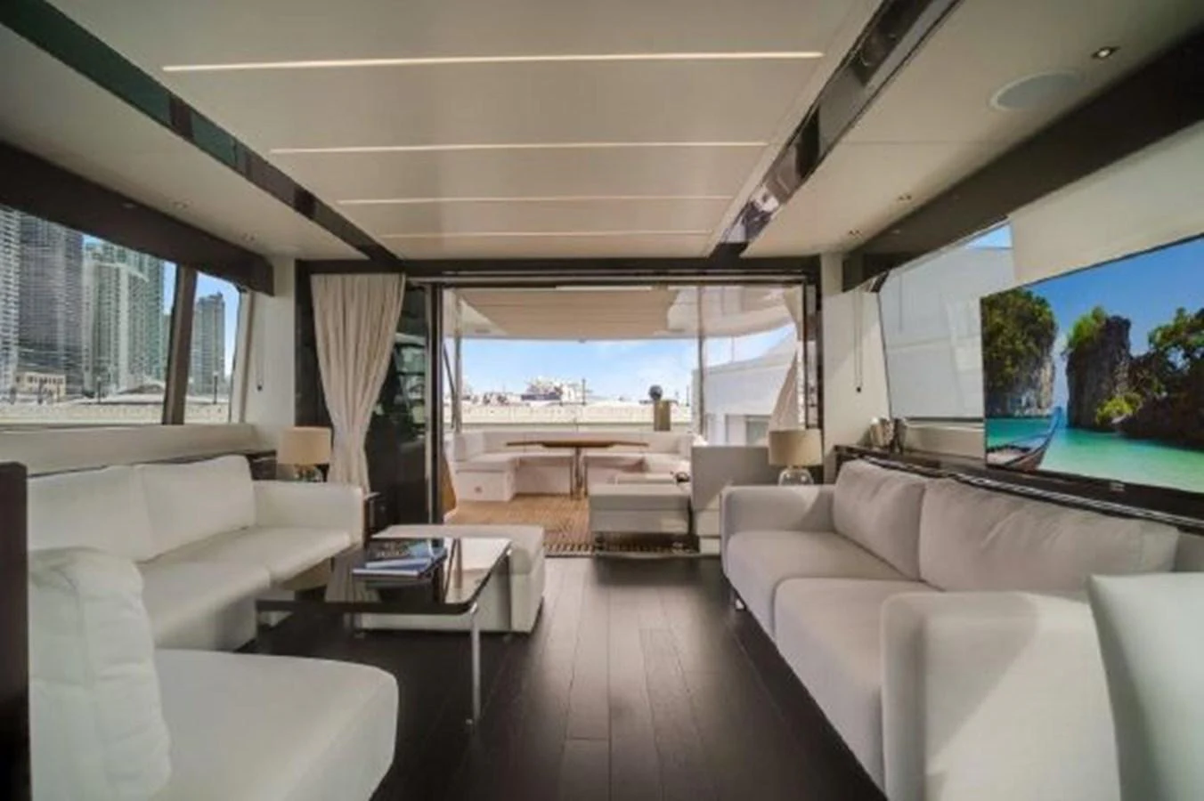 a living room with a large window aboard SOLAIRE Yacht for Sale