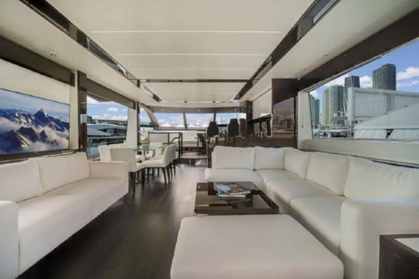 a room with couches and tables aboard SOLAIRE Yacht for Sale