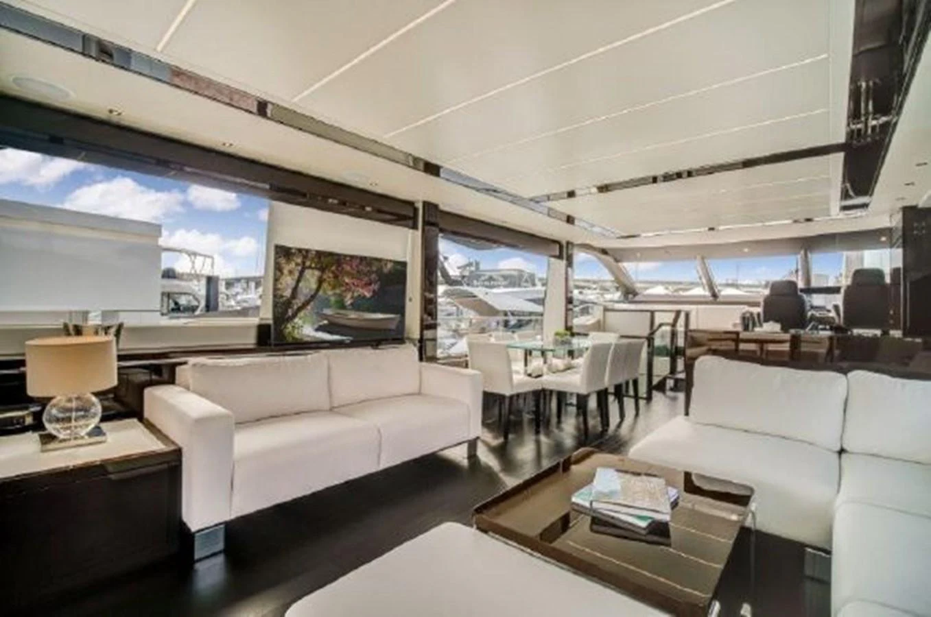 a living room with a large window aboard SOLAIRE Yacht for Sale