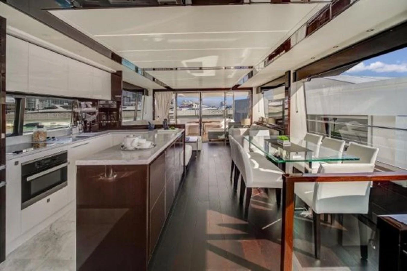 a kitchen with a table and chairs aboard SOLAIRE Yacht for Sale