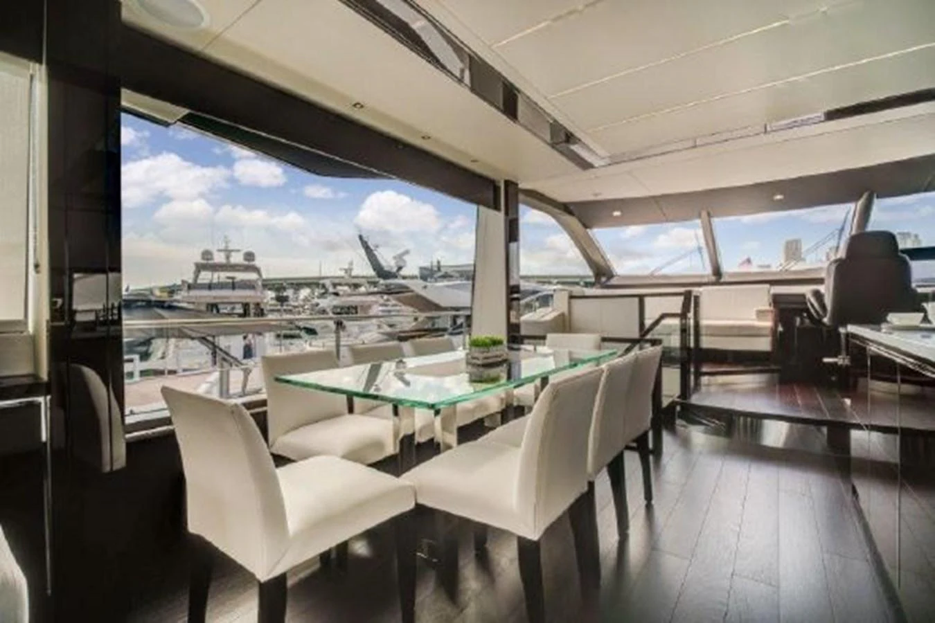 a room with a table and chairs aboard SOLAIRE Yacht for Sale