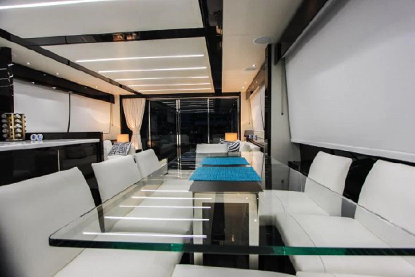 a room with a table and chairs aboard SOLAIRE Yacht for Sale