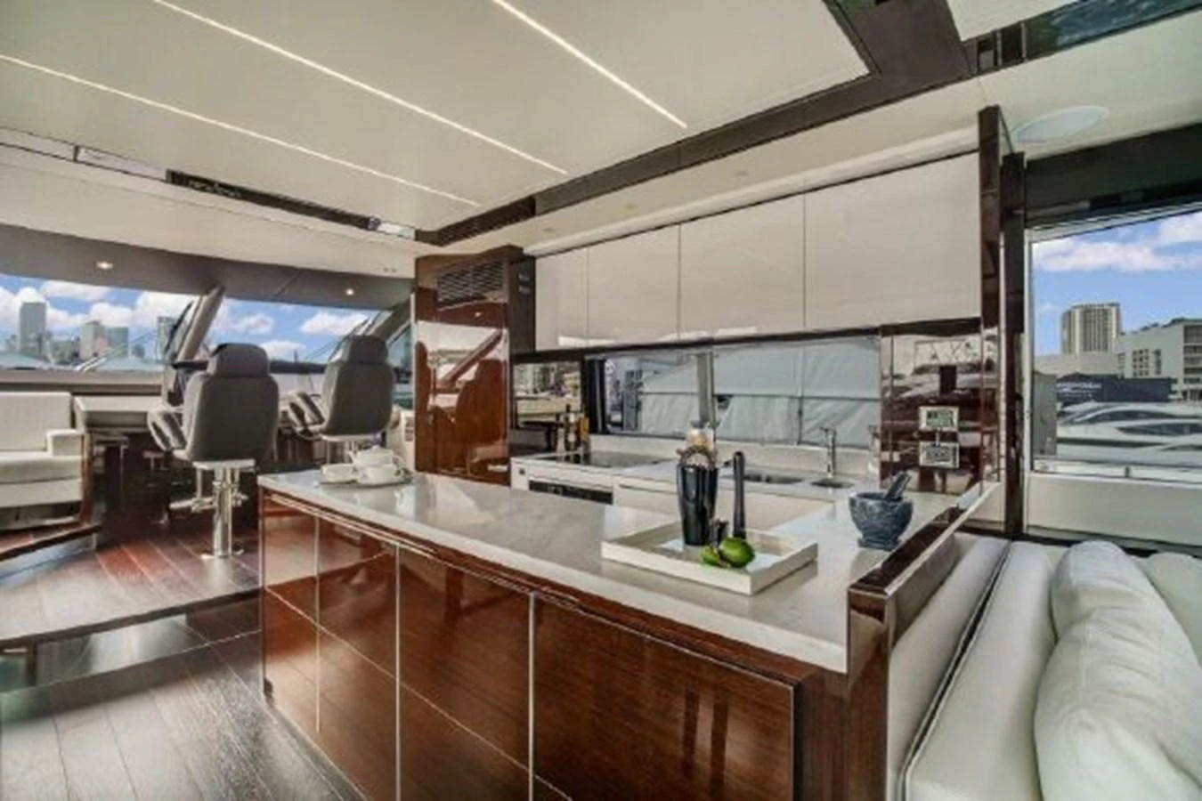 a room with a counter and chairs aboard SOLAIRE Yacht for Sale
