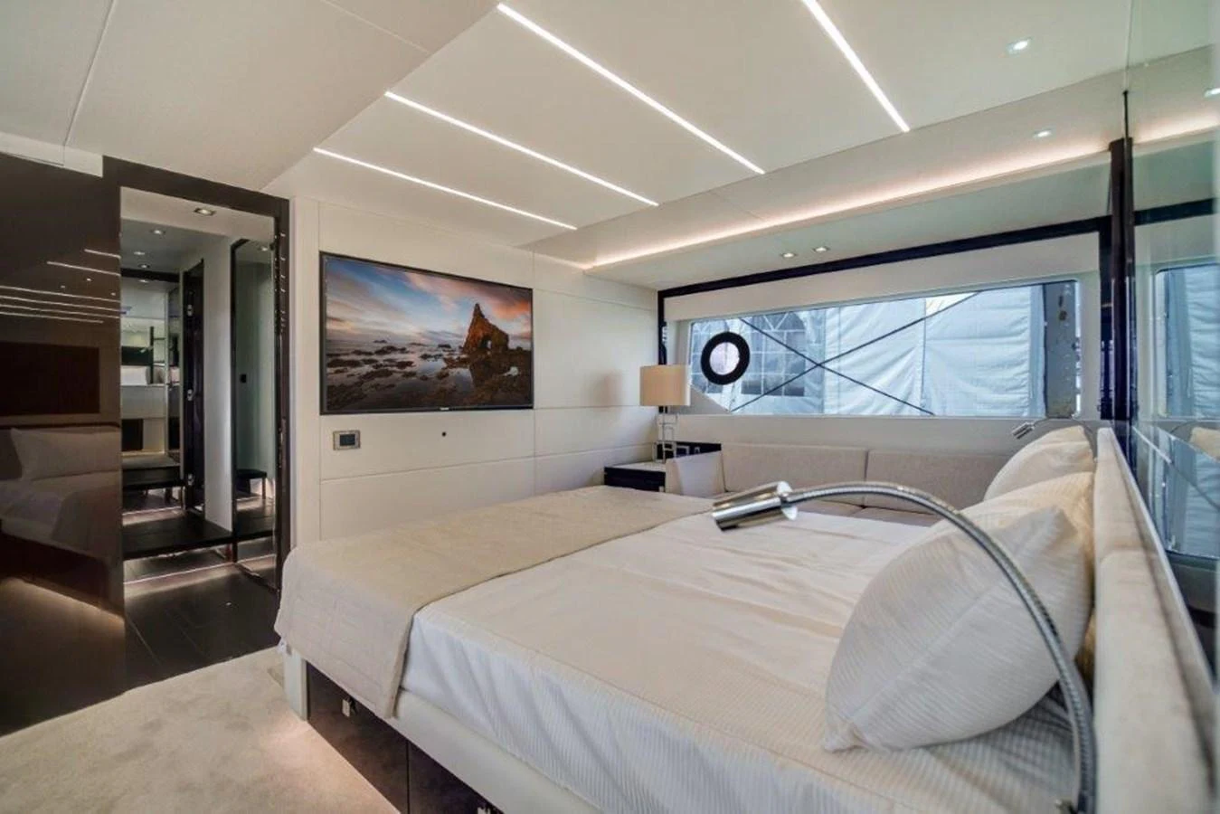 a bedroom with a large bed aboard SOLAIRE Yacht for Sale