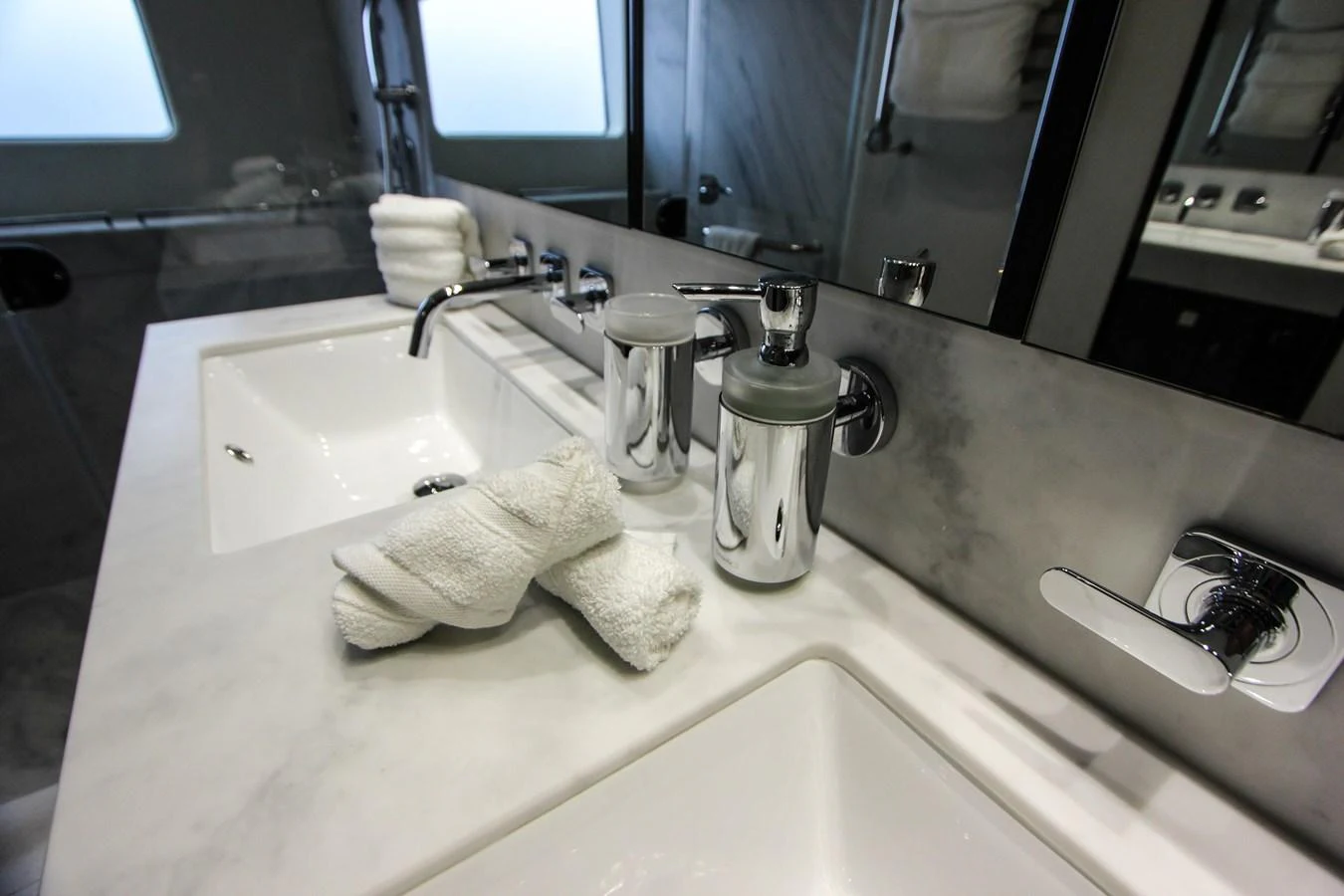 a bathroom with a sink and a mirror aboard SOLAIRE Yacht for Sale