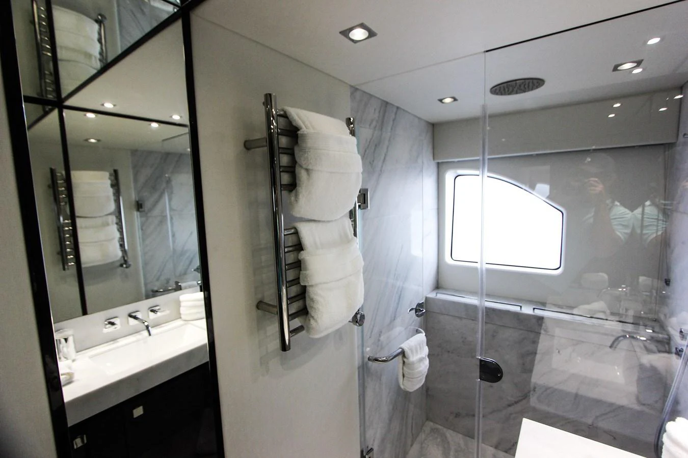 a bathroom with a glass shower aboard SOLAIRE Yacht for Sale