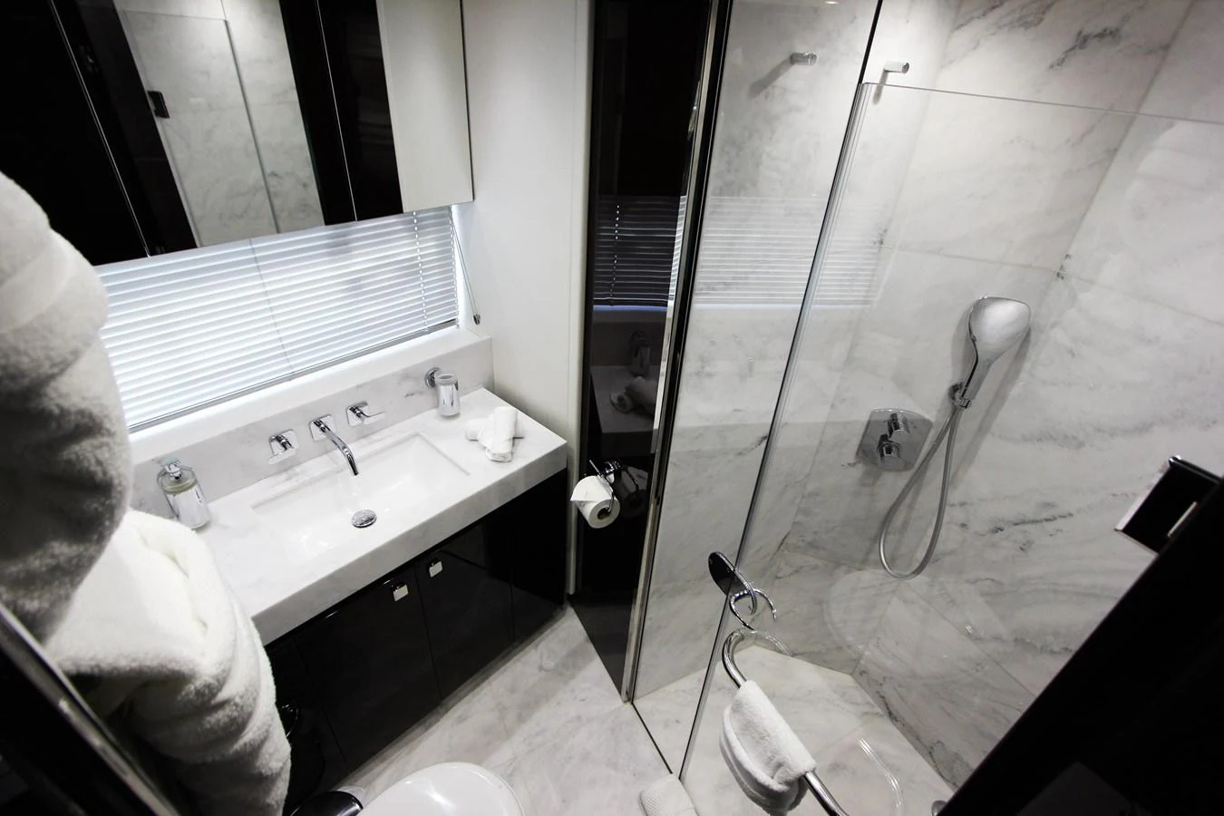 a bathroom with a sink and a mirror aboard SOLAIRE Yacht for Sale