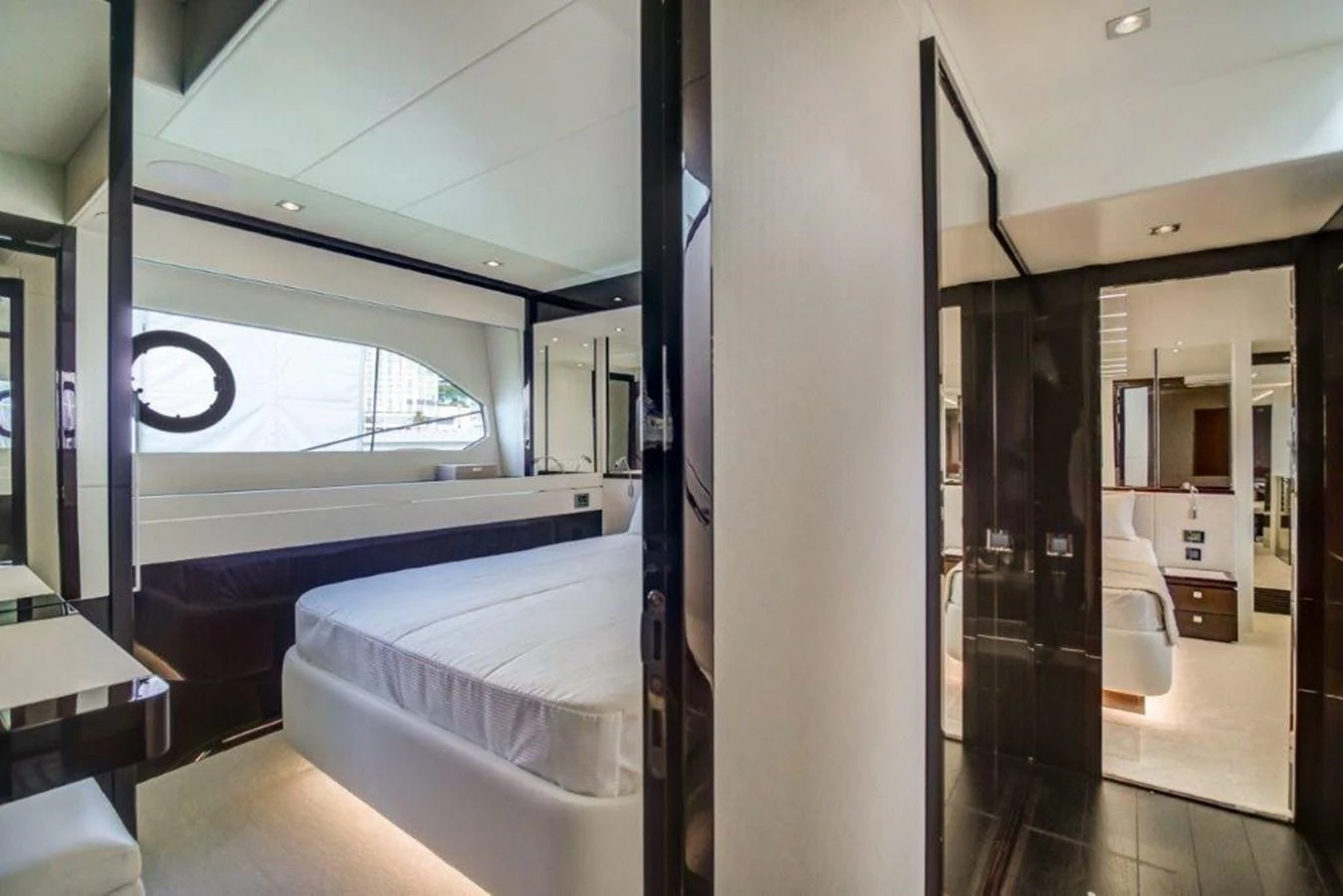 a room with a bed and a desk aboard SOLAIRE Yacht for Sale