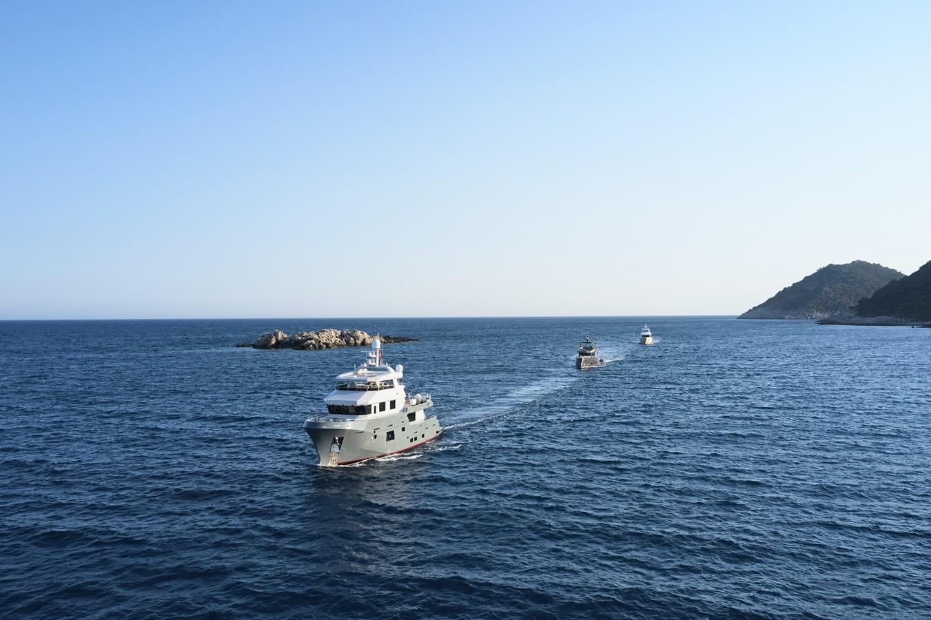 a couple of boats in the water aboard BERING 88/05 Yacht for Sale