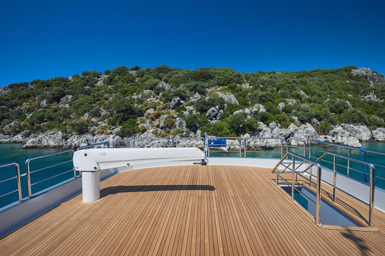 a wooden deck overlooking a body of water aboard BERING 88/05 Yacht for Sale