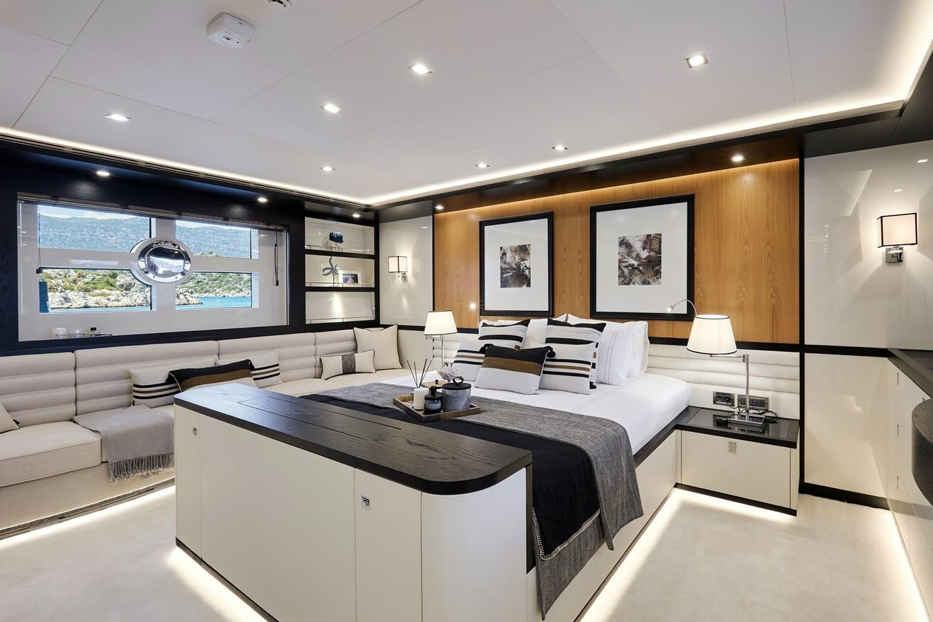 a modern bedroom with a large window aboard BERING 88/05 Yacht for Sale