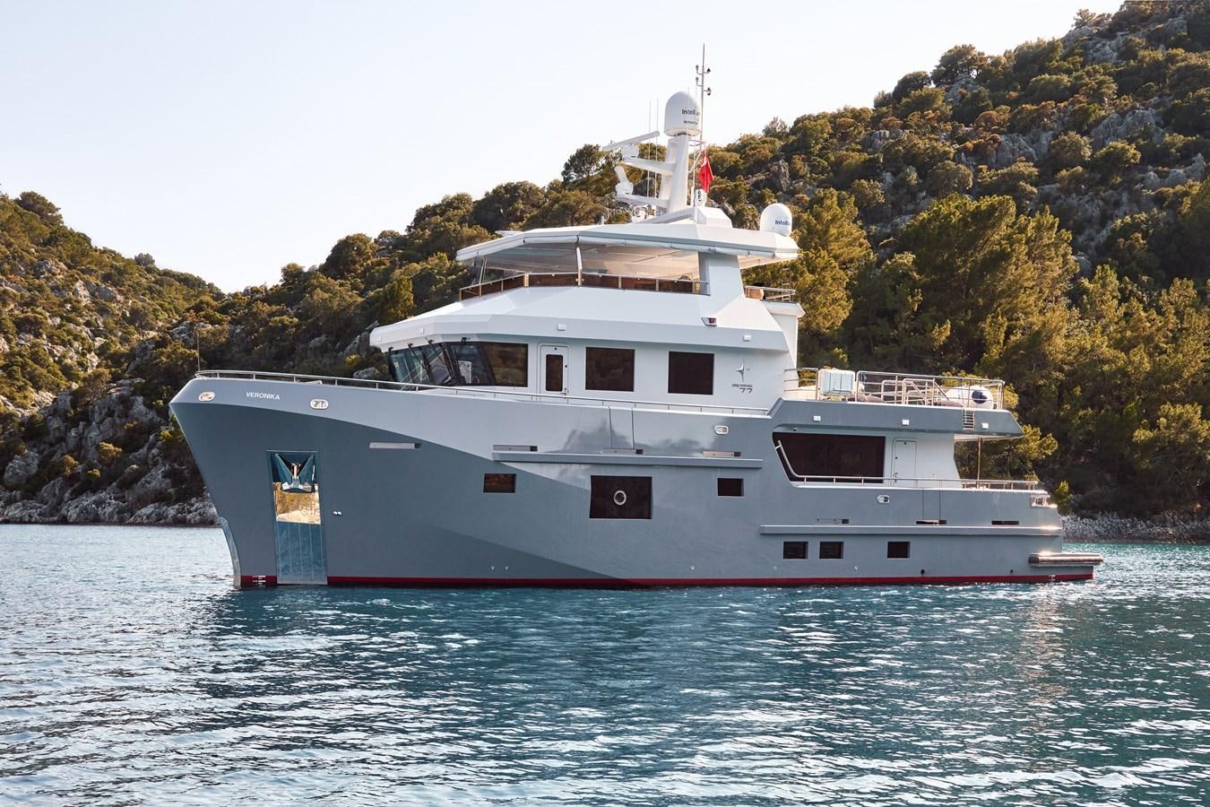 a large white boat on the water aboard BERING 88/05 Yacht for Sale