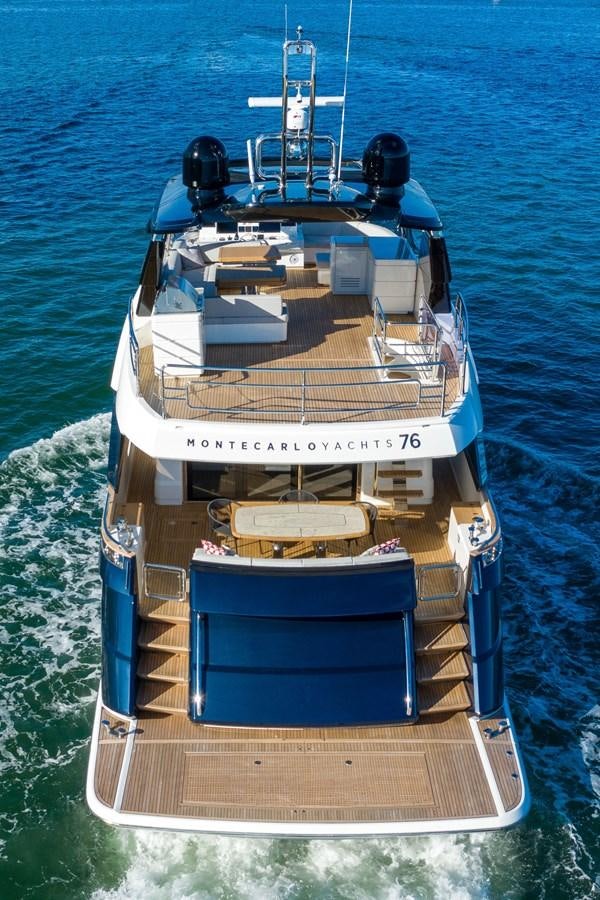 a boat with a large engine aboard MONTE CARLO YACHTS MCY 76 Yacht for Sale