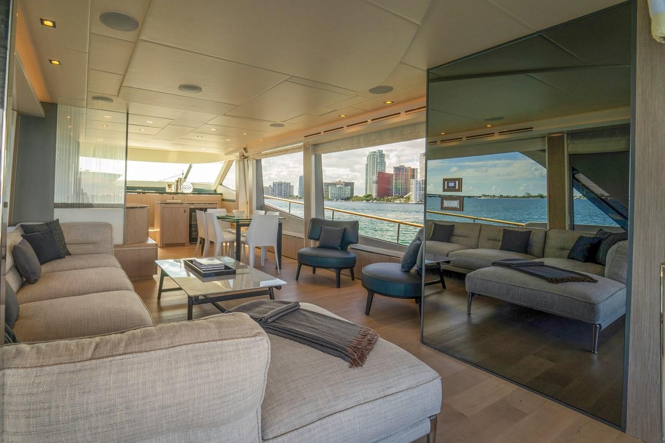 a living room with a large window aboard MONTE CARLO YACHTS MCY 76 Yacht for Sale