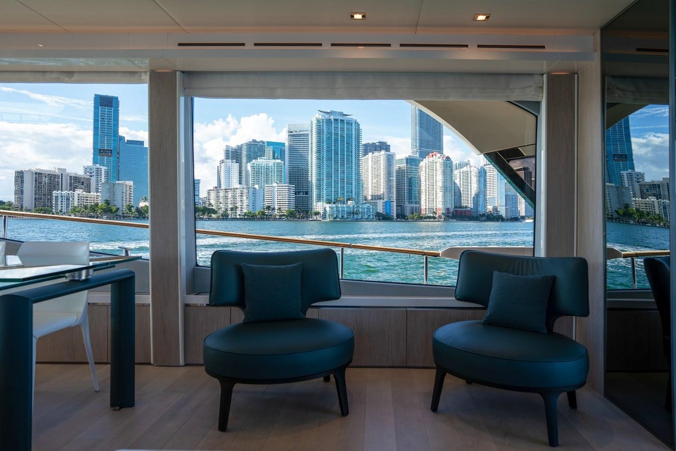 a room with a view of a city and a large window aboard MONTE CARLO YACHTS MCY 76 Yacht for Sale