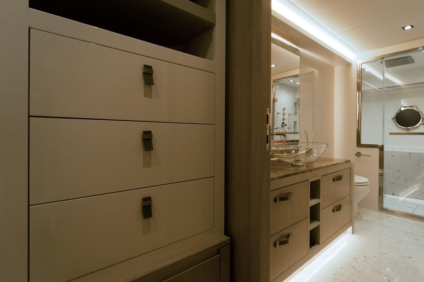 a bathroom with a sink and cabinets aboard MONTE CARLO YACHTS MCY 76 Yacht for Sale